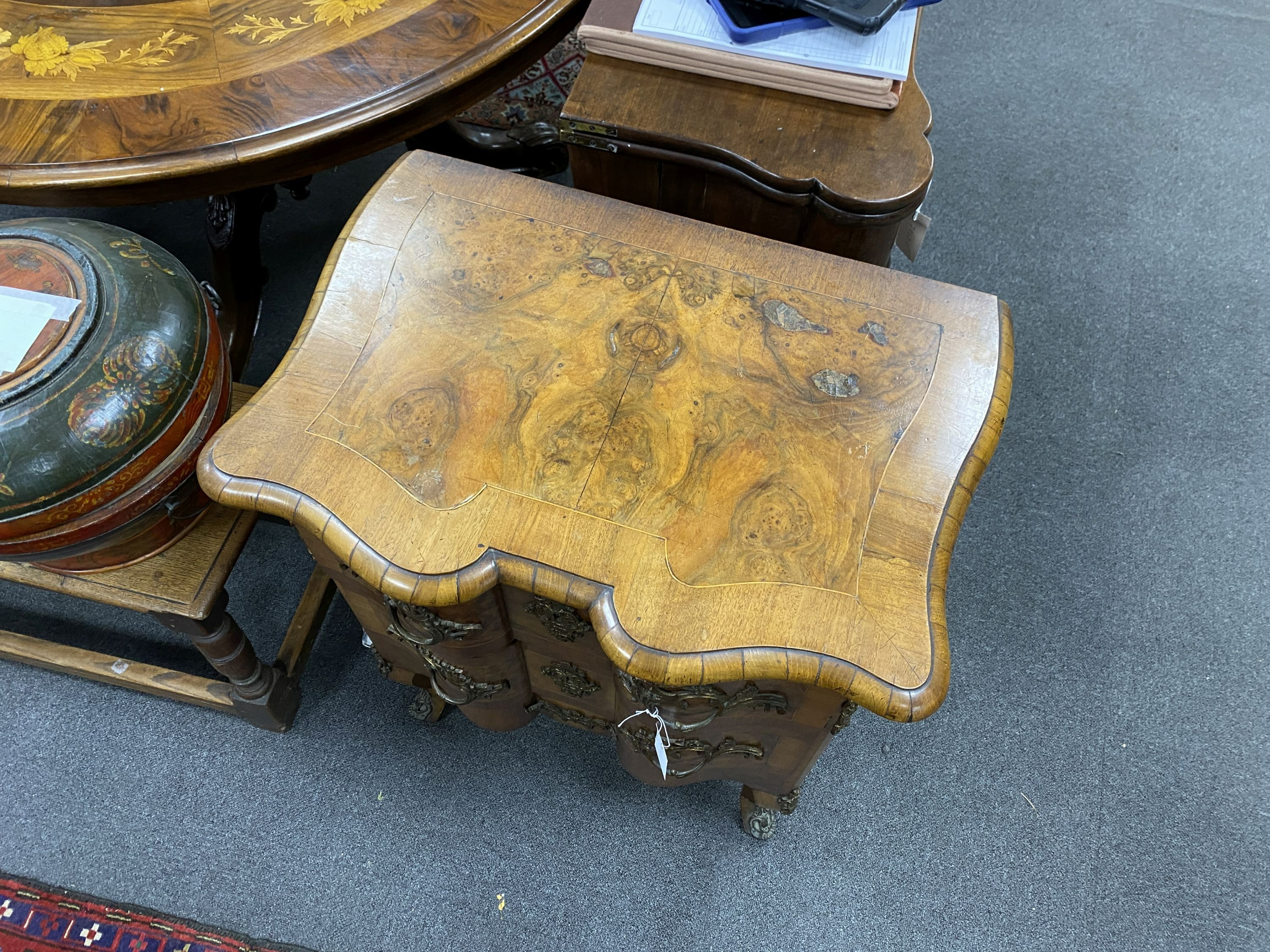 An early 20th century French gilt metal mounted walnut petit commode, width 62cm, depth 44cm, height 76cm